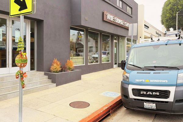Trip's Windows van parked outside an office building for commercial window cleaning