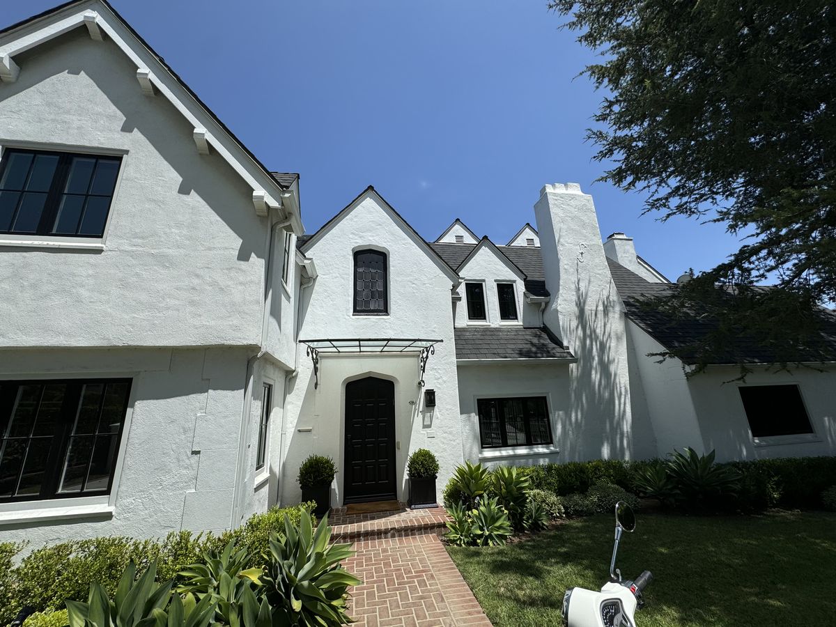 Professional gutter cleaning on a Los Angeles residential home by Trip's Windows